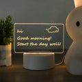 LED Acrylic Note Board with handwritten daily goals on a wooden desk