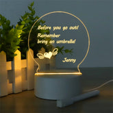 LED Acrylic Note Board with handwritten daily goals on a wooden desk